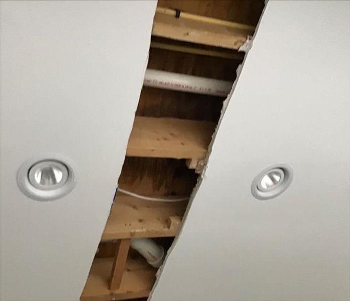 Whole in ceiling due to loss.