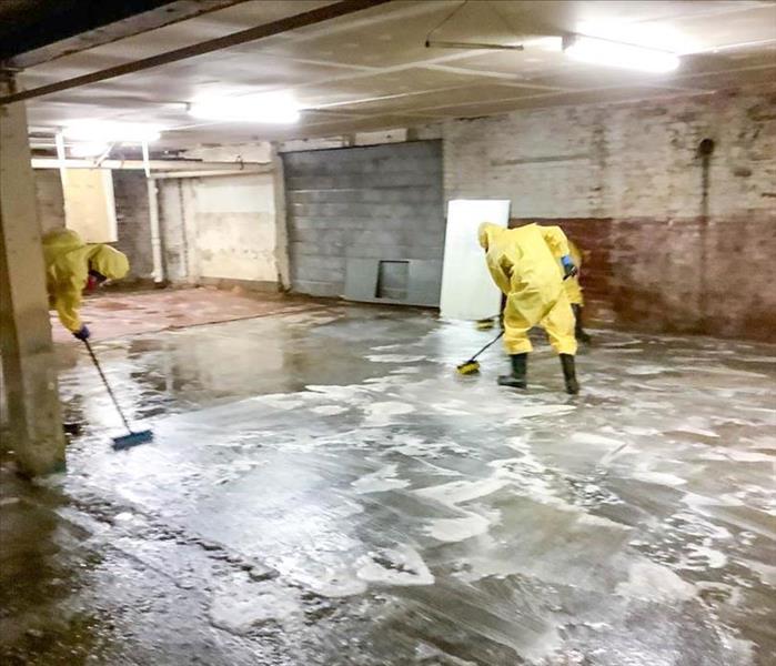 SERVPRO employee cleaning floor 